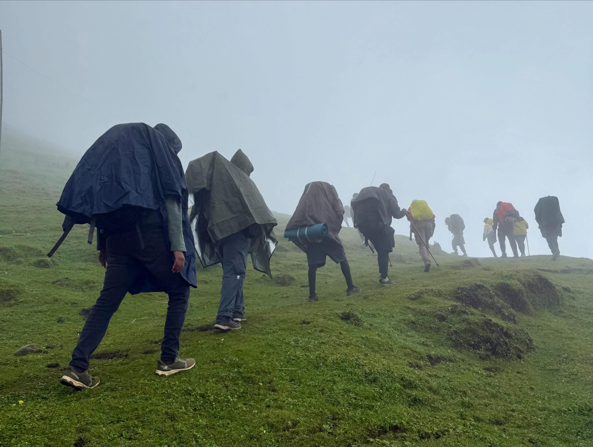 Hikers climbing through mountain mist in Ethiopia